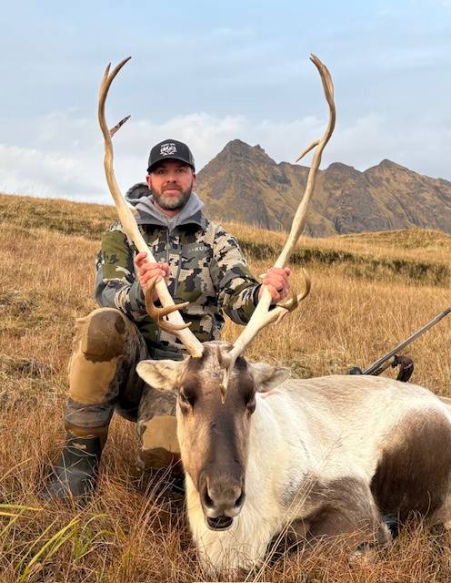 Solo hunter with trophy Caribou on the mountain