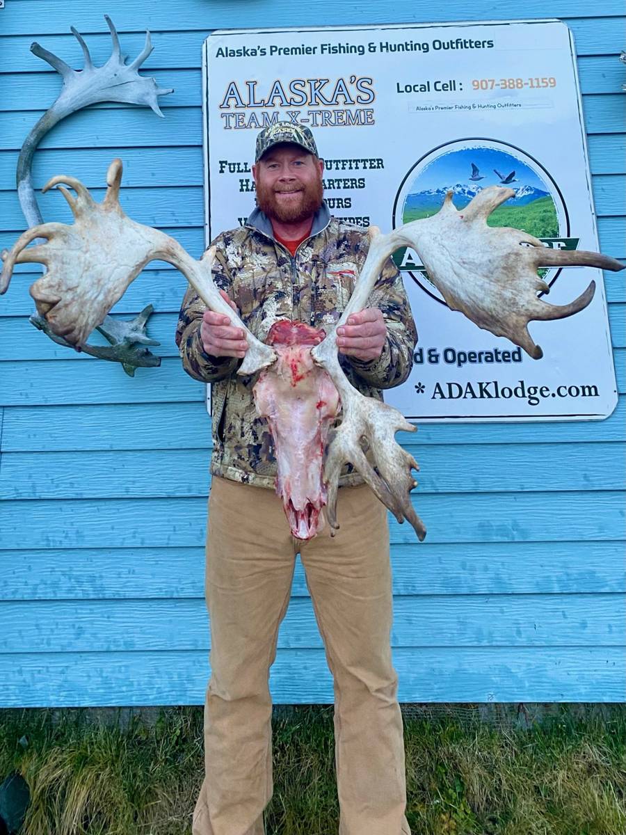 Hunter with a massive wide European mount Caribou rack