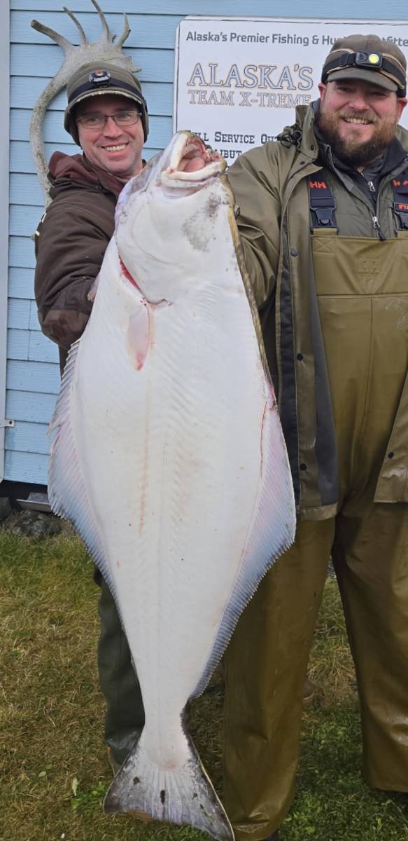 Hunters with trophy Halibut at Adak Lodge