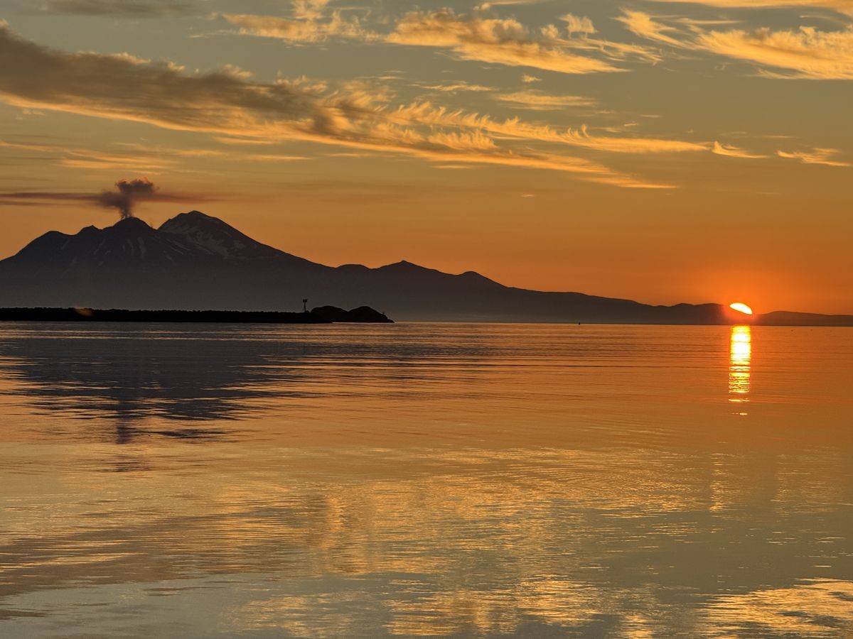 Adak sunset over the volcano